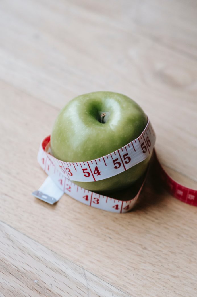 Photo by Andres  Ayrton: https://www.pexels.com/photo/green-apple-with-measuring-tape-on-table-in-kitchen-6550823/