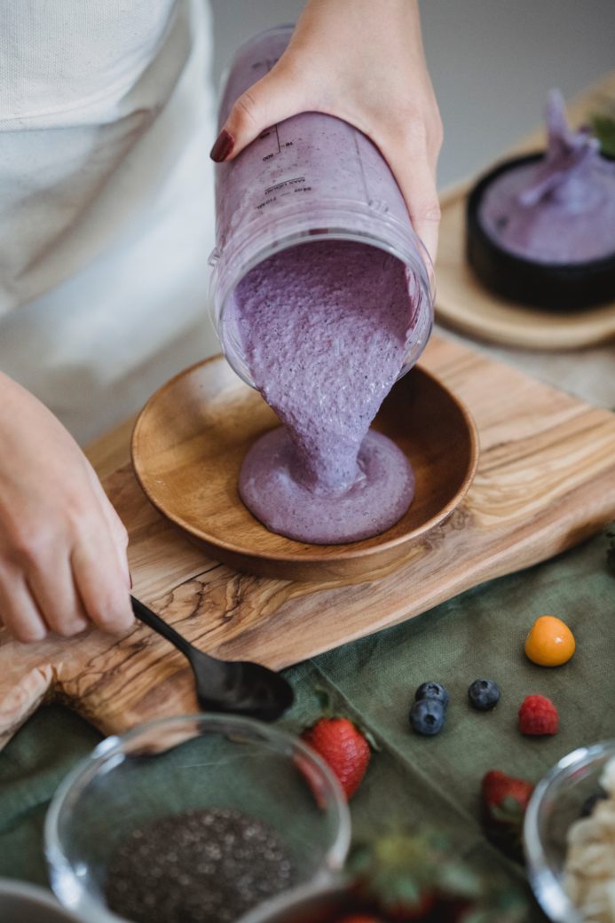 Photo by Nicola Barts : https://www.pexels.com/photo/a-person-putting-smoothie-in-a-wooden-bowl-7936986/