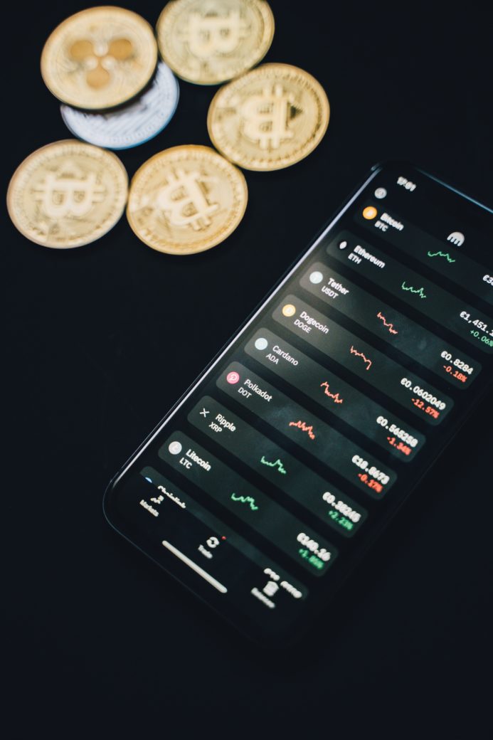 Photo by Alesia  Kozik: https://www.pexels.com/photo/coins-scattered-near-smartphone-with-financial-charts-on-screen-6771985/