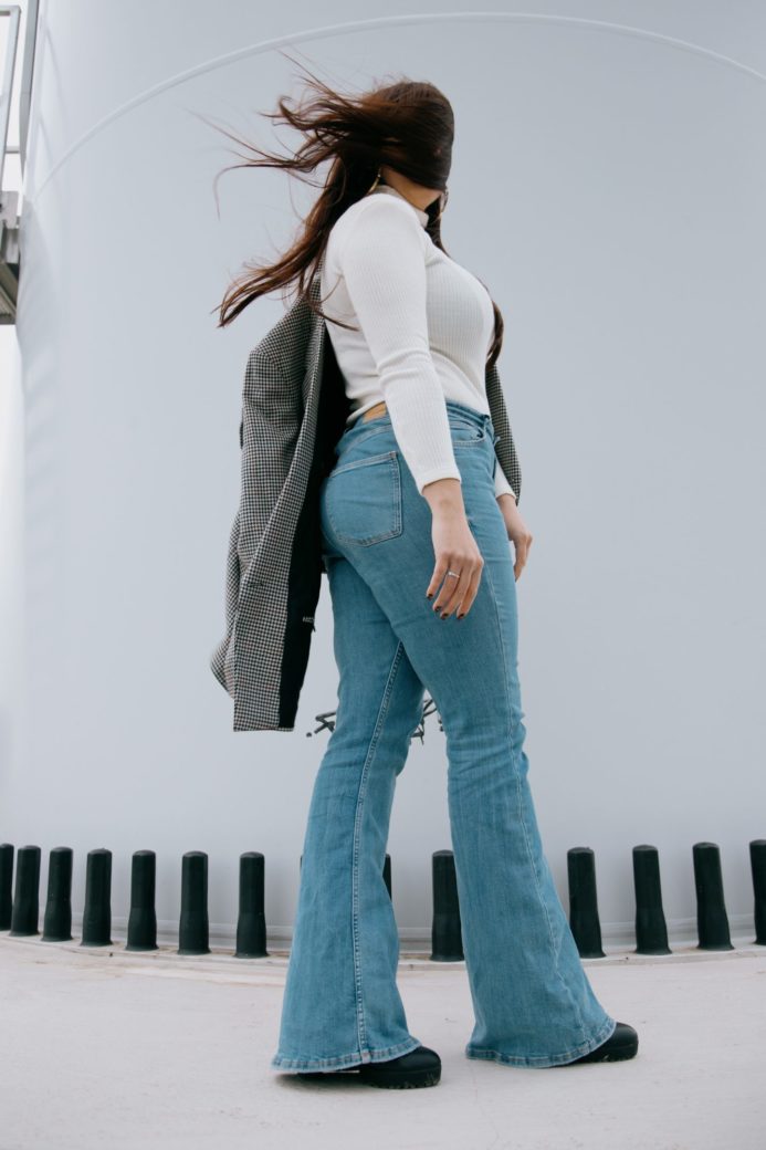 Photo by Sinitta Leunen: https://www.pexels.com/photo/faceless-woman-in-jeans-and-sweater-standing-on-white-background-5661304/