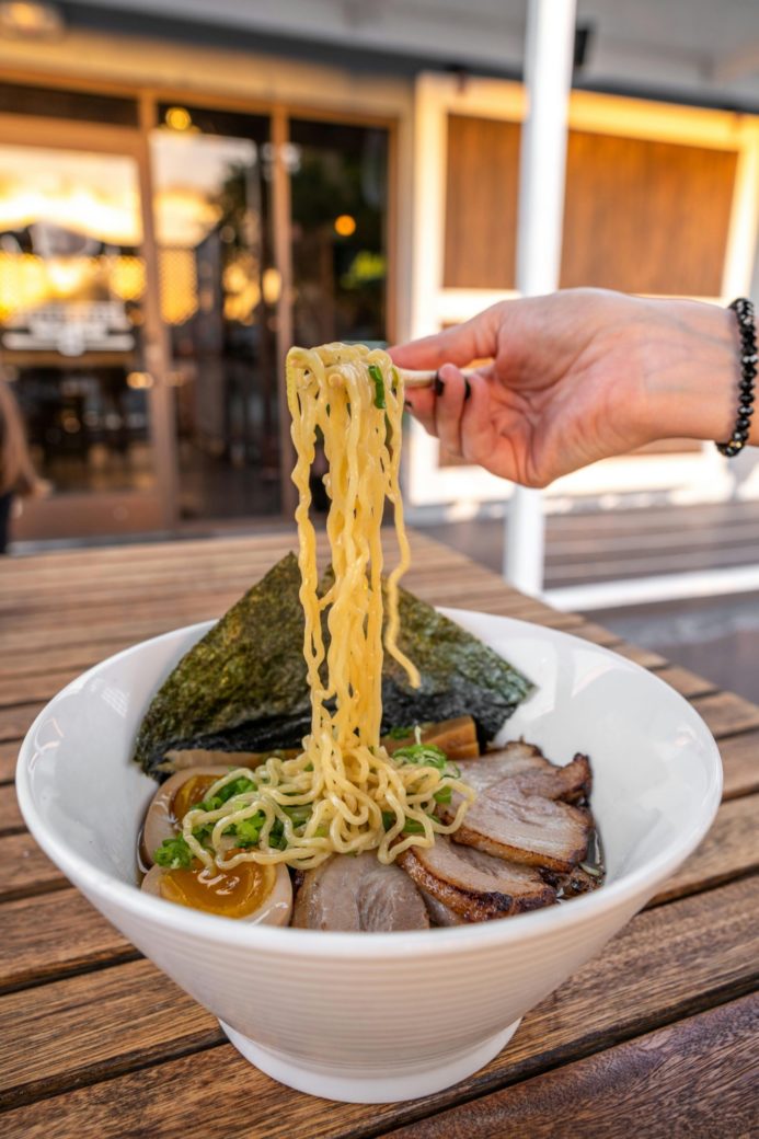 Photo by ALTEREDSNAPS  : https://www.pexels.com/photo/a-person-holding-a-fork-over-a-bowl-of-ramen-16068658/