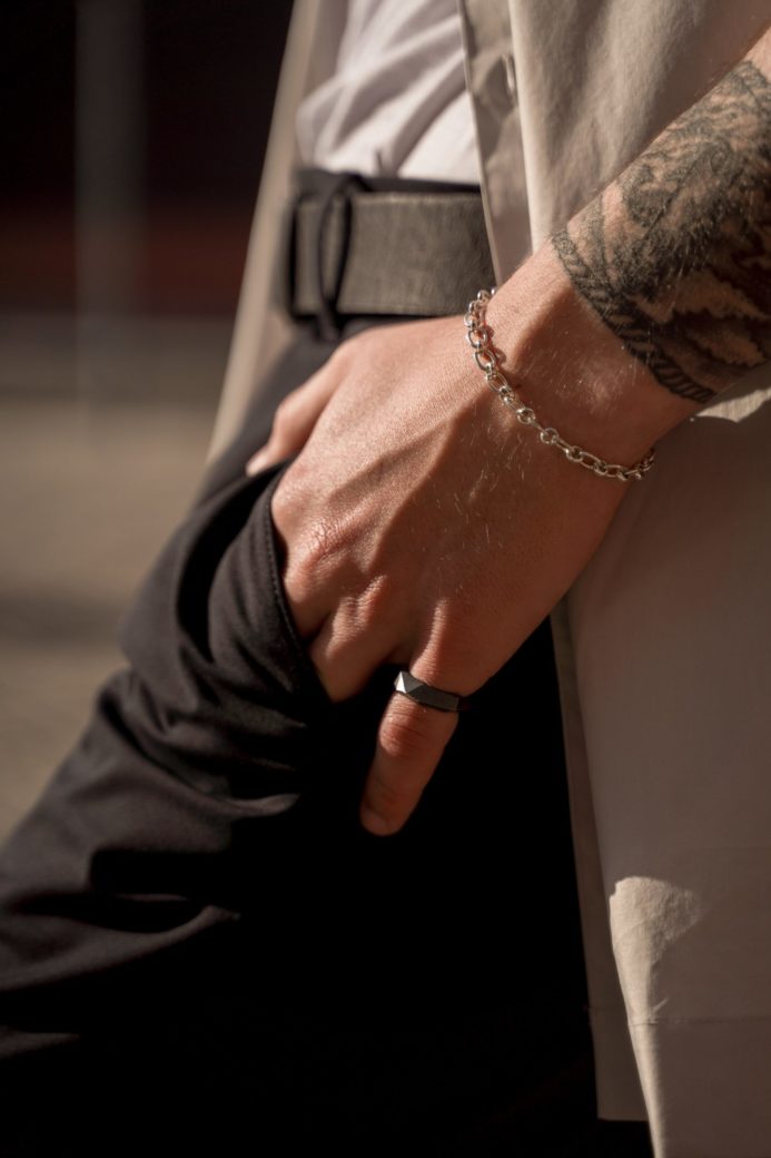 Photo by cottonbro studio: https://www.pexels.com/photo/man-wearing-bracelet-and-ring-on-a-hand-10330415/