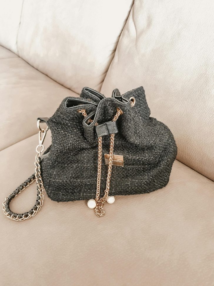 Photo by Tal Gold: https://www.pexels.com/photo/a-black-bucket-bag-on-the-sofa-8909025/