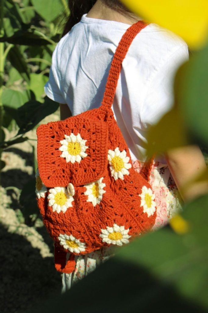 Photo by Ebru Yılmaz: https://www.pexels.com/photo/a-girl-wearing-a-crocheted-backpack-17768106/
